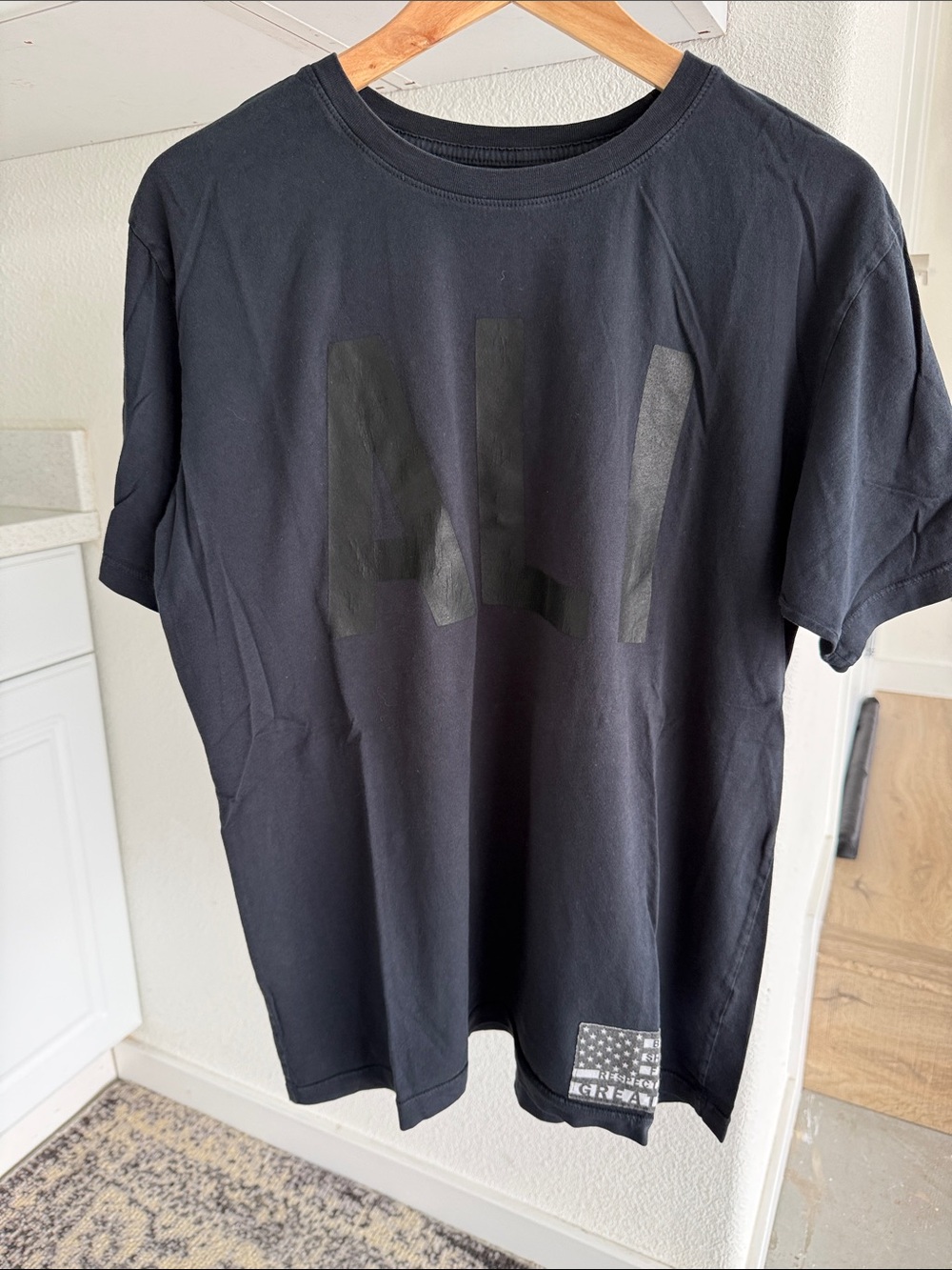 Faded vintage black ALI Roots of Fight Men’s tee